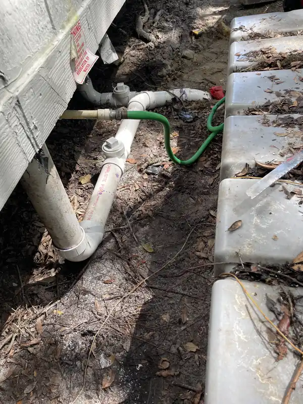 Centrel Services sewer jetting trailer parked and operating outside a residence